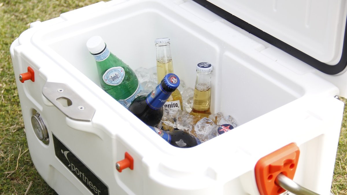 Ice cooler with assorted cold drinks and bottles