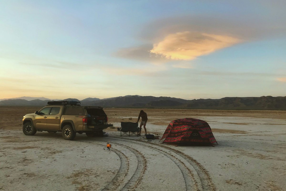 black suv on gray sand during daytime